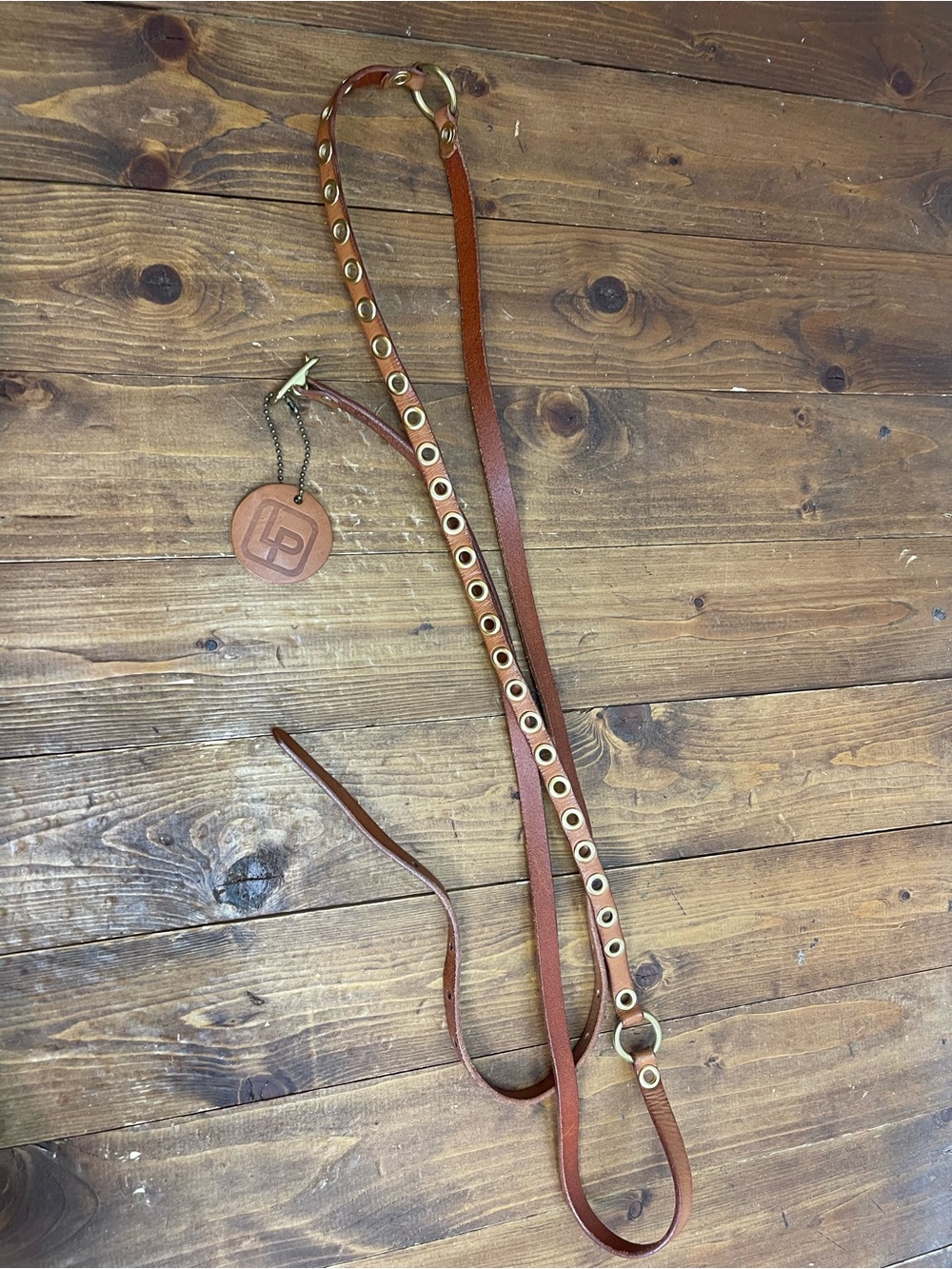 Linea pelle size medium tan leather skinny belt with grommets double wrap